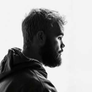 grayscale photo of man facing right